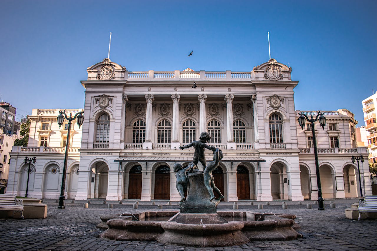 Grand neoclassical historic building and fountain in an Argentine city square