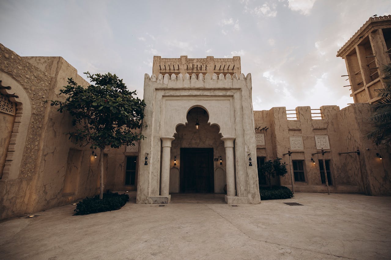 Traditional Arabian architecture with arched entrance and courtyard