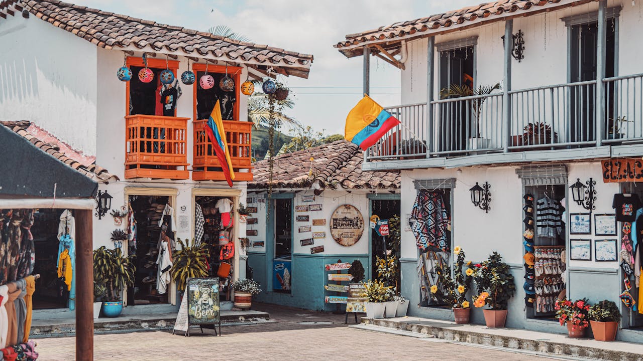 Traditional Colombian colonial buildings decorated with national flags and local crafts
