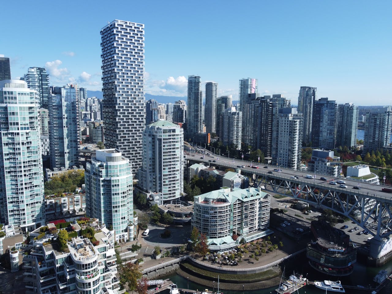 Modern Vancouver skyline with high-rise buildings, waterfront and bridge